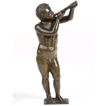 Statuette - A boy blowing a trumpet