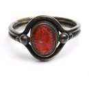 Hand pinching an ear (Intaglio)