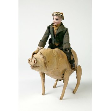 Clockwork toy pig with rider