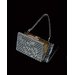 Handbag with powder puff and lipstick