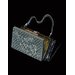 Handbag with powder puff and lipstick