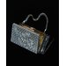 Handbag with powder puff and lipstick