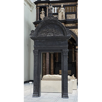 Architecture doorway - Doorway surmounted by a figure of St. Stephen and carved with a relief of the Nativity