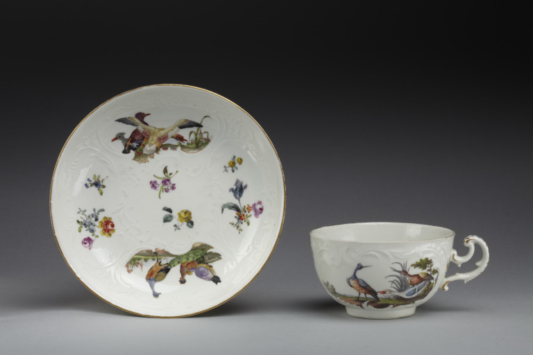 Teacup and saucer, hard-paste porcelain with relief-moulded decoration, painted ...