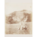 Three figures by a wheelbarrow at Rheola (Photograph)