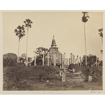 Photograph - Anuradhapura. The Thúpáráma Dágoba. View from the south-east. This Dágoba was built by King Déwánpiya Tissa, about 300 years before the Christian era, to enshrine the right collar-bone of Buddha. It is the oldest point of antiquity, and is always approached by the numerous pilgrims who visit the spot with the greatest possible awe and veneration. The Dágoba is constructed of stone and brick to the height of 63 feet, and has a diameter, at the base, of 59 feet. It is surrounded by 128 particularly graceful columns, arranged in three rows; those in the first row nearest the Dágoba being 52 in number and 20 feet 3 inches high from the surface of pavement, up to the capitals in the second row, 36 in number, and 19 feet 6 inches high, and in the outer row 40 in number and 17 feet 6 inches high- all the shafts being monoliths.; The Thúpáráma Dágoba at Anuradhapura: view from the south-east.