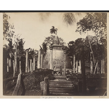 Photograph - Mihintale- The Ambastala Dágoba. This Dágoba was erected over the ashes of the great missionary Mahindo, who came to Ceylon B.C. 307, and died in the year 267 B.C. It also marks the spot where he appeared in the form of an elk to King Déwánpiya Tissa, and converted that monarch to Buddhism. It is built of brick, plastered with chunam, and measures 23 feet in diameter at the springing of the bell. Fifty-two columns in two rows surround the Dágoba; those in the inner circle numbering twenty, and in the outer circle thirty-two. The shafts are 12 feet high from pavement, and are finished with carved capitals.; The Ambastala Dágoba at Mihintale
