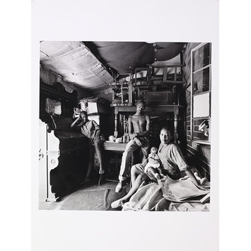 Photograph - The leader of the Vikings Gang with his wife, child and sister, at home, Orlando East, Soweto. Photograph - The leader of the Vikings Gang with his wife, child and sister, at home, Orlando East, Soweto.