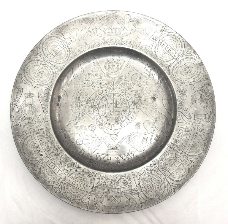 Pewter dish with broad rim. Modern engraving all over upper surface. English, made 1664, engraved ca.1920.