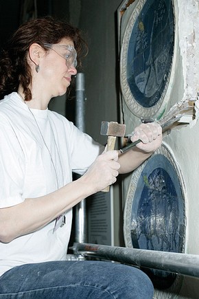Figure 2. Removal of one of the della Robbia roundels from the old display (Photography by Sculpture Conservation).