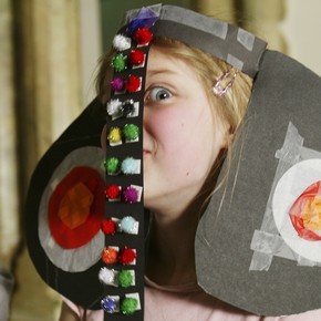 Child wearing her stylised elephant mask made using a V&A activity backpack.