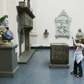 Young girl taking a photograph in the galleries, Every Object Tells a Story V&A family activity, 2004.