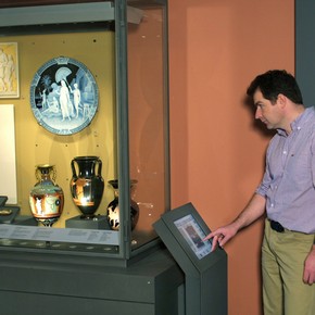 A visitor using a gallery interactive in the British Galleries, 2004.
