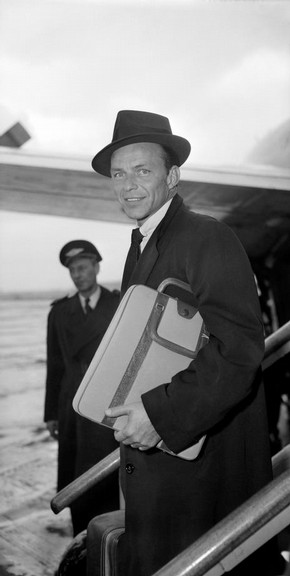 Frank Sinatra arriving at London Airport, photography by Harry Hammond, 1956. Museum no. S.15111-2009