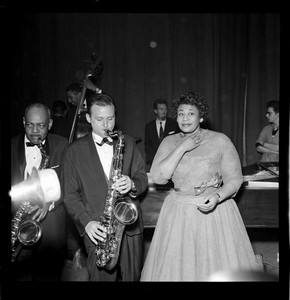 Ella Fitzgerald with backing musicians, photography by Harry Hammond, London Palladium, 1958, Museum no. S.11159-2009