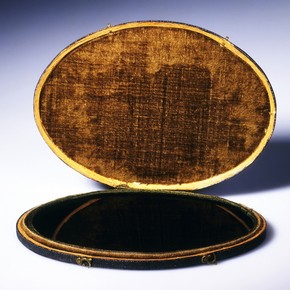 Blackened convex mirror known as a 'Claude glass' inside a leather case, England, UK, 18th century. Museum no. P.18-1972