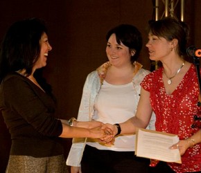 Sharhin-Azar-Azirani receiving the award from Melanie Vandenbrouck-Przybylski and Amy Mechowski