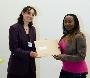 Jackie Wamaitha on behalf of Laura Caiafa receiving the Word and Image book prize from Marilyn Greene on behalf of Barbara Lasic