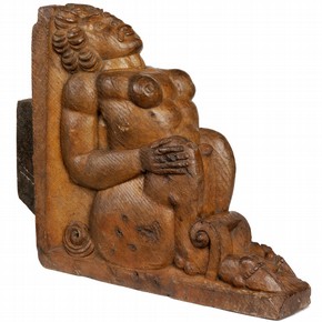 Carved oak bracket in the form of a naked crouching monster, from Sir Paul Pindar's house, Bishopsgate, London, 1599-1600. Museum no. 1561-1901