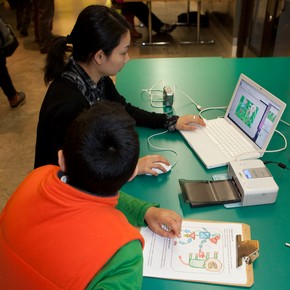 Laptop connected to digital camera and photo printer at the SAP Digital Design Weekend, 2010.