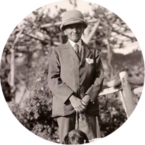 Full-length standing portrait of Stein and his dog Dash. © The British Library