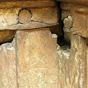 Detail of the framing for the large exterior panels of Sir Paul Pindar's house, showing carpenters' scratched assembly marks and wooden pegs used to secure the joints. Museum no. 846-1890
