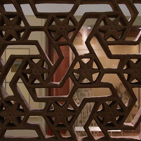 Interior of the South Asian gallery (Room 41), seen through a geometrical stone window