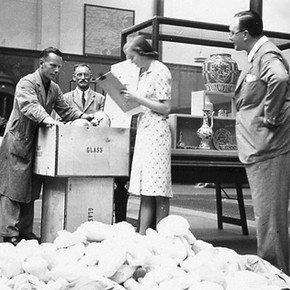 Ceramic objects being packed, about 1939.