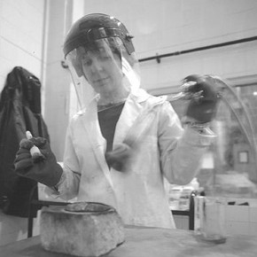 Figure 2. Lyndsey Morgan patinating bronze samples in the patination room at the RCA Sculpture School.