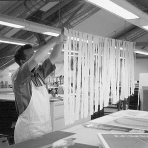 Figure 1. Chris Gingell preparing the strips of Japanese paper with Lascaux as described in the text. Photograph by Pauline Webber.