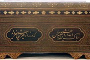 Casket, wood with a mosaic veneer of mother-of-pearl, metal and stained ivory with verses in ivory marquetry; Iran (probably Tehran), 1800-50. Museum no. 501-1874.