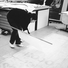 Figure 3. Lining the poster. Photography by Pauline Webber.