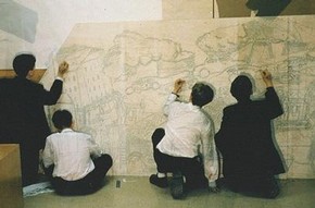 Students drawing the outline of their mural