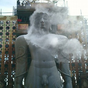 Statue of Bahubali being anointed with rice flour, photograph, Raju Shah, Karnataka, 2006