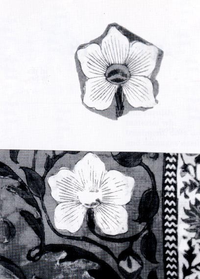 Fig. 2 The old patching repair of a similar flower motif and the residue of dry paste were removed