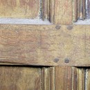 Detail of the interior panelling showing original pegs and traces of paint