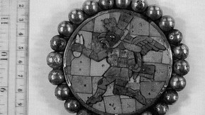 Fig. 2. Ear spool from Loma Negra, North Peru, (3-6 century AD.). Gold with stone and shell inlays depicting a bird-headed winged runner.