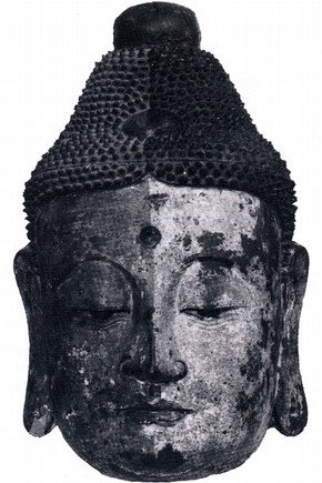 Figure 1. Varnish partly removed, revealling a layer of bright pink paint.