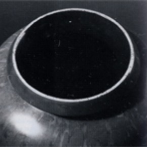 Figure 2. A detail of the vase showing the crushed eggshell decoration around the rim, before conservation