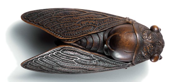 Netsuke of a cicada on a twig; carved wood; 19th century. Museum no. A.993-1910