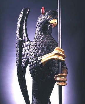 Carved, painted and gilded oak griffin, with tinned copper banner, 1507–25. Museum no. W.7-2000