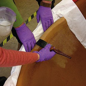 Figure 2. Applying Impranil® DLV to the chair (Photography by Nigel Bamforth)