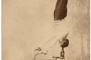 Trick Cyclist balancing on a bottle on a bike, late 19th century
