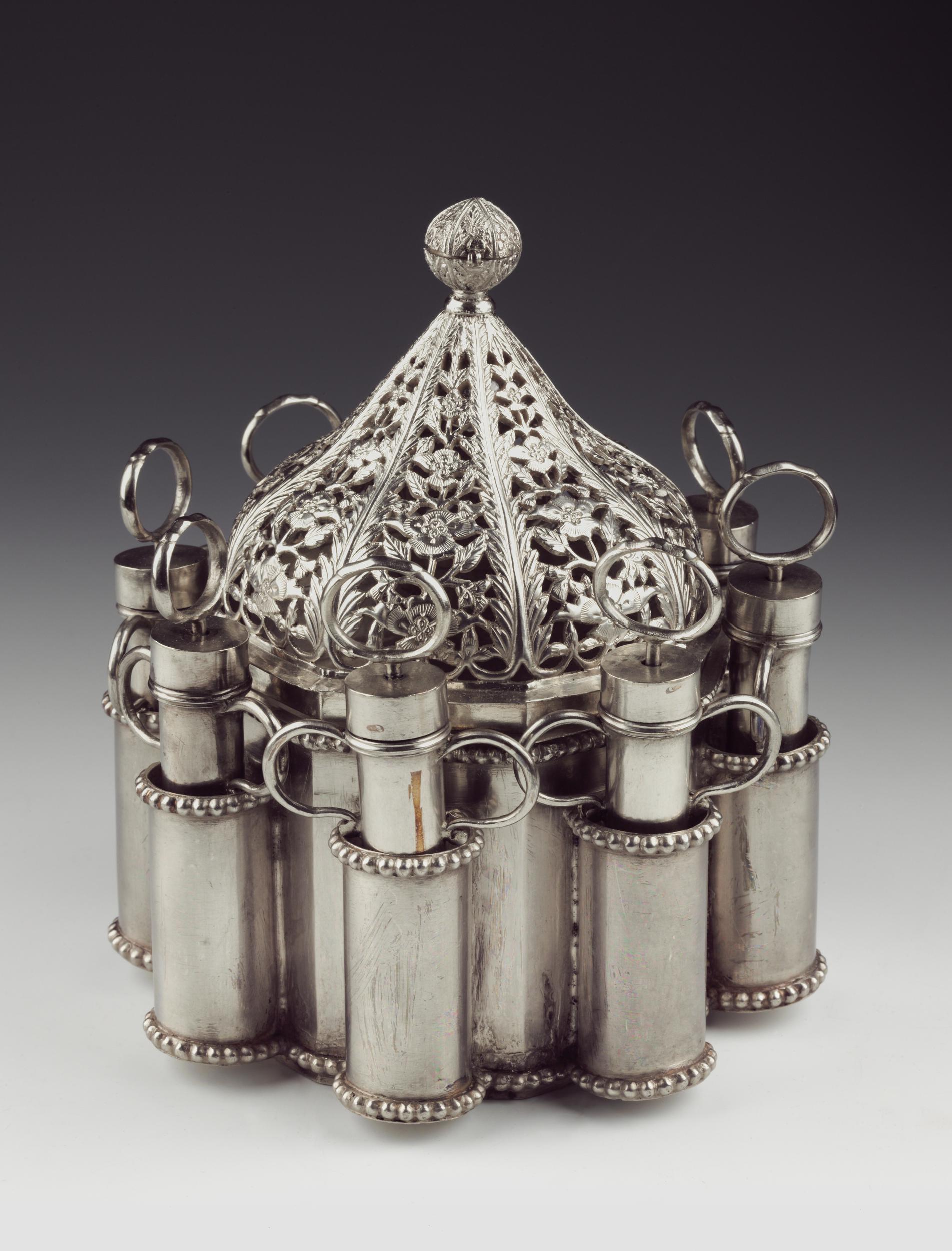 Silver pichkaris / syringes used by royals for holding coloured water in the 19th century. The central part of the object is covered with filigree work. <br>The Rajahs and the Nawabs all exchanged rose water bottles and sprinkled it on each other amid the frenzied drumming of the 'nagaras' (musical instruments). <br><br><hr> In 20-Holi-Pictures: Celebration through the Ages