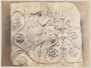 photograph - Bas-relief of a geni and a lyre in terra cotta photograph - Bas-relief of a geni and a lyre in terra cotta
